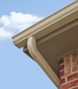 seamless gutters with downspout on brick home